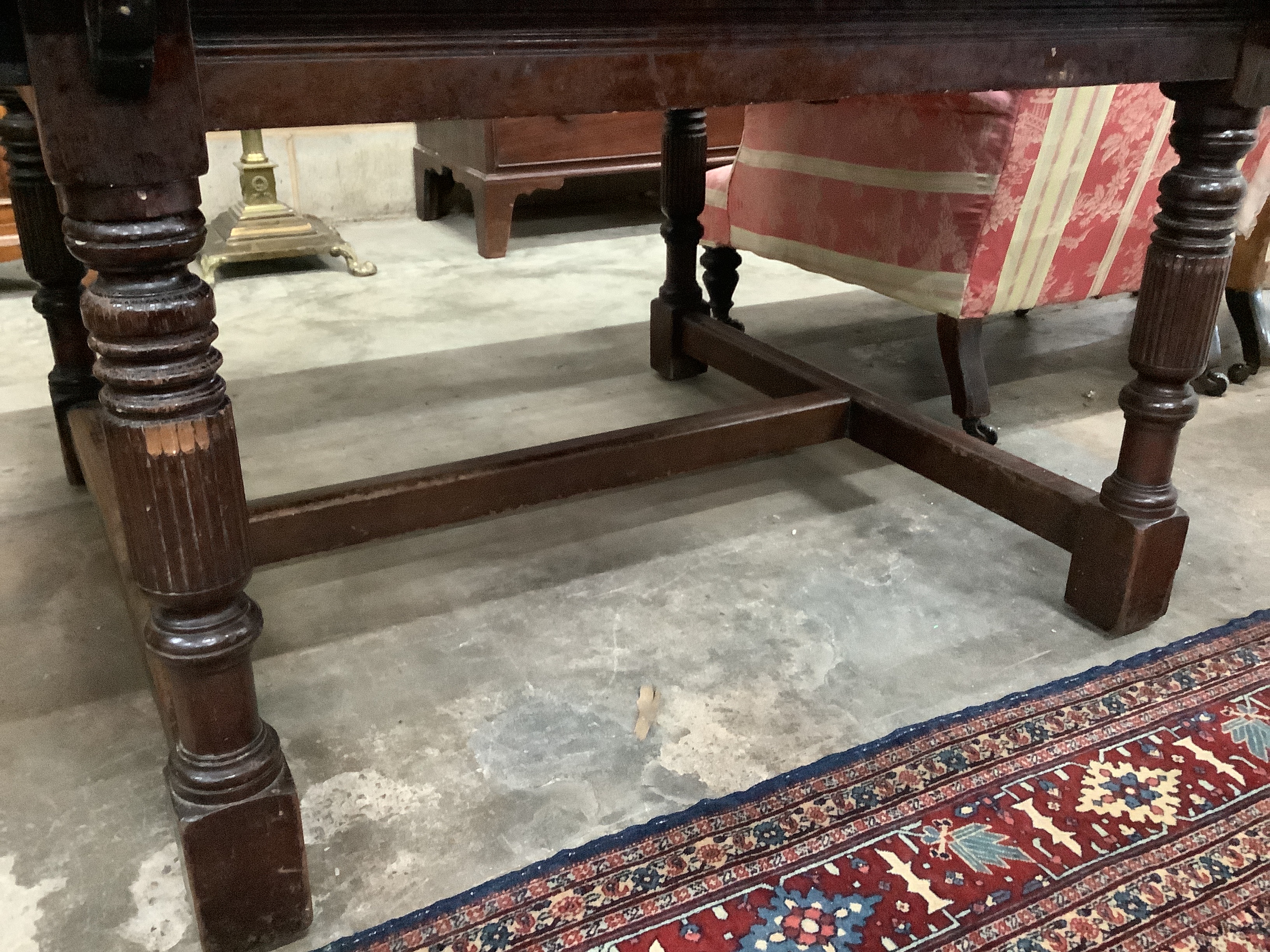 A continental mahogany extending dining table, approx. 180cm extended, width 122cm, height 70cm